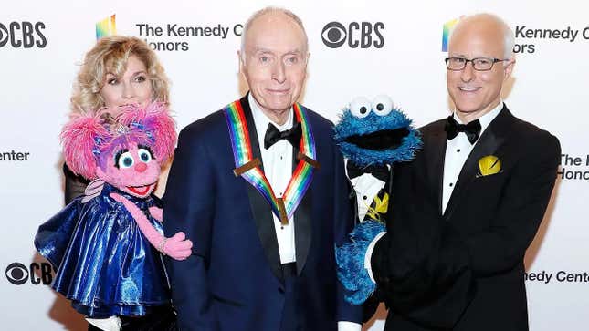 Lloyd Morrisett (C) with Abby Cadabby (L) and Cookie Monster (R)